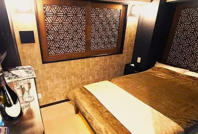 a bedroom with a bed in a room at Hotel Opera in Tokyo