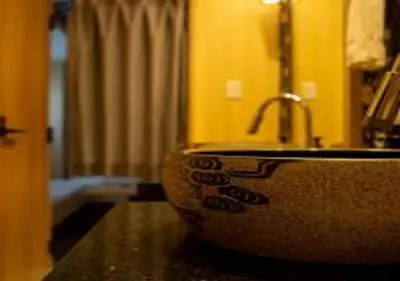 a bathroom with a sink in a room at Hotel Opera in Tokyo
