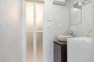 a bathroom with a shower and a sink at The Sanctus \u6075\u6bd4\u5bff in Tokyo