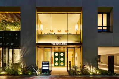 a building with a front entry with a sign on it at The Royal Park Hotel Ginza 6-Chome in Tokyo