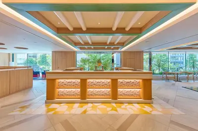 a lobby with a reception counter and windows at The Royal Park Hotel Ginza 6-Chome in Tokyo