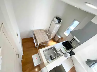 an overhead view of a small kitchen with a table at \uff28\uff2f\uff34\uff25\uff2c\u3000\uff25\uff2c\u30009 in Tokyo