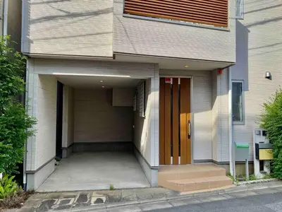 a building with a garage with a door at \uff28\uff2f\uff34\uff25\uff2c\u3000\uff25\uff2c\u30009 in Tokyo