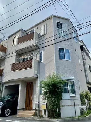 a building with a car parked in front of it at \uff28\uff2f\uff34\uff25\uff2c\u3000\uff25\uff2c\u30009 in Tokyo