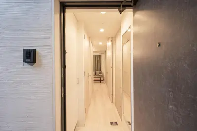 a hallway with a door leading into a room at KiSETSU\u65e9\u7a32\u7530II in Tokyo