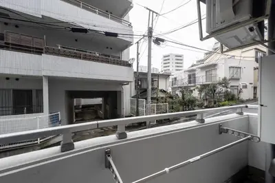 a view of a building from a balcony at S-K MANSION in Tokyo