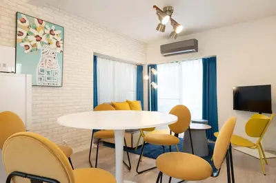 a meeting room with a table and chairs at Kisa in Tokyo