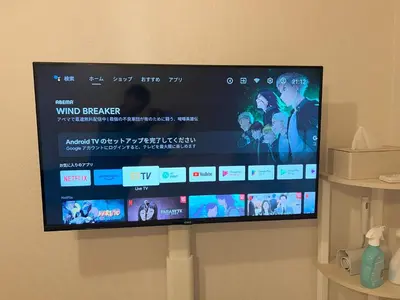 a large flat screen tv hanging on a wall at 4 min walk from Shibuya Station! (From A0 Exit) in Tokyo