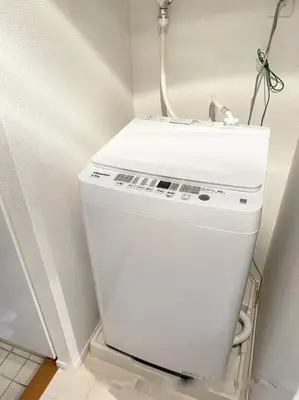 a white refrigerator in a corner of a room at 4 min walk from Shibuya Station! (From A0 Exit) in Tokyo