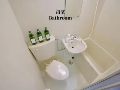 a bathroom with a toilet and a sink and bottles of wine at 7\u6642IN19\u6642OUT # \u65b0\u5bbf\u99c5\u96fb\u8eca4\u5206 # \u99c58\u5206 # \u65b0\u898f\u30ea\u30ce\u30d9\u30fc\u30b7\u30e7\u30f3 # \u6700\u59275\u540d # \u5c02\u7528\u30d0\u30b9\u30ad\u30c3\u30c1\u30f3 # 7 00 IN19 00 OUT # 4 min train to Shinjuku # 8 min walk to station # Newly renovated # Max 5 guests # Private bath kitchen in Tokyo