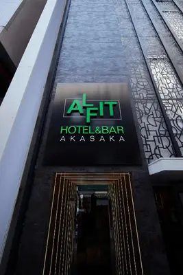 a sign for a hotel and bar in a building at ALFIT HOTEL & BAR AKASAKA in Tokyo