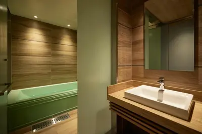 a bathroom with a sink and a bath tub at ALFIT HOTEL & BAR AKASAKA in Tokyo