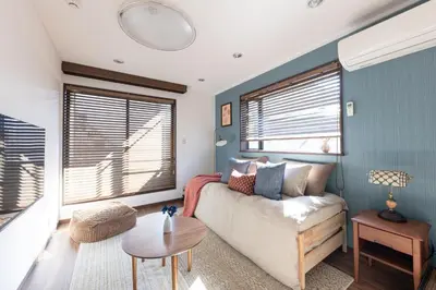 a living room with a couch and a table at Shibuya-ku - Apartment - Vacation STAY 72219v in Tokyo
