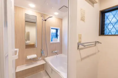 a bathroom with a bath tub and a sink at Shibuya-ku - Apartment - Vacation STAY 72295v in Tokyo