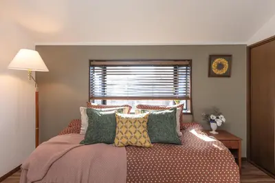 a bedroom with a bed with pillows and a window at Shibuya-ku - Apartment - Vacation STAY 67815v in Tokyo