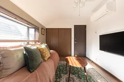 a living room with a couch and a flat screen tv at Shibuya-ku - Apartment - Vacation STAY 67815v in Tokyo