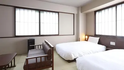 a hotel room with two beds and two windows at Onyado Nono Asakusa Annex - Natural Hot Spring in Tokyo