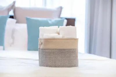 a basket of toilet paper sitting on a table at walk to Higahsi Shinjuku sta. EEY in Tokyo