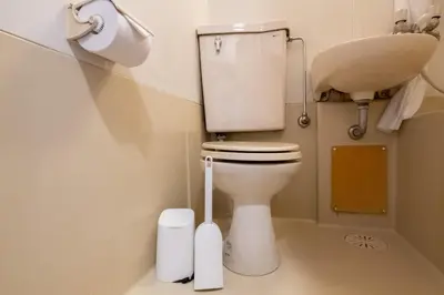a small bathroom with a toilet and a sink at \u30d1\u30ed\u9577\u5d0e in Tokyo