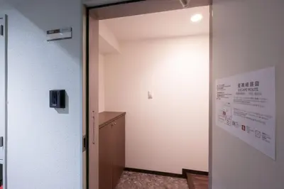 a door in a room with a wall at \u30e9\u30a4\u30ef\u30de\u30f3\u30b7\u30e7\u30f3\u5357\u9ebb\u5e03 in Tokyo