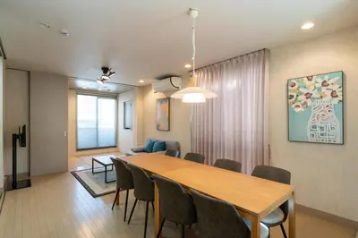a dining room and living room with a table and chairs at \u6771\u99d2\u5f622\u4e01\u76ee\u6238\u5efa in Tokyo
