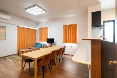 a kitchen and dining room with a table and chairs at KAIGAN HAJIME Hub in Tokyo