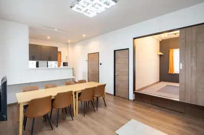 a kitchen and dining room with a table and chairs at KAIGAN HAJIME Hub in Tokyo