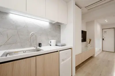 a kitchen with a sink and a counter top at The Monica Residence ShinjukuGyoen in Tokyo