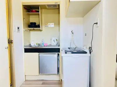 a small kitchen with a sink and a stove at Okubo abia house-SJ0155 in Tokyo