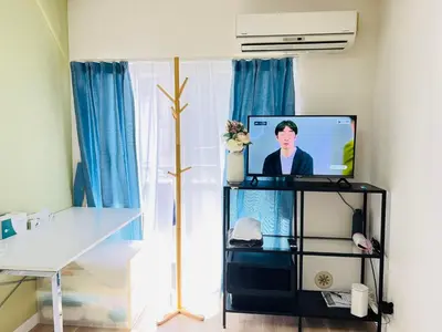 a tv sitting on a stand in a room at Okubo abia house-SJ0155 in Tokyo