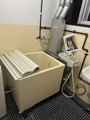 a bath tub sitting in a bathroom next to a sink at \u6c34\u4ed9 Kamata in Tokyo