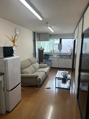 a living room with a couch and a table at \u6c34\u4ed9 Kamata in Tokyo