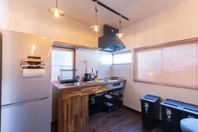 a kitchen with a sink and a refrigerator at \u548c\u6c23\u4f1a\u3005\u65b0\u5927\u4e45\u4fdd Wakiaiai Shinokubo in Tokyo