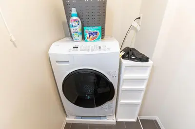 a washer and dryer in a laundry room at \u548c\u6c23\u4f1a\u3005\u65b0\u5927\u4e45\u4fdd Wakiaiai Shinokubo in Tokyo