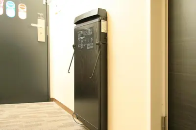 a vending machine in a room next to a door at Richmond Hotel Tokyo Suidobashi in Tokyo
