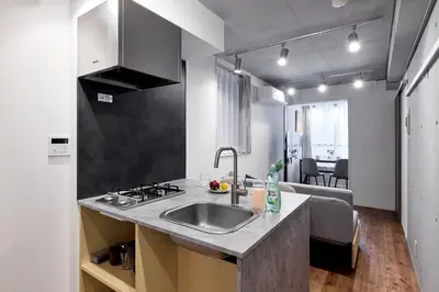 a kitchen with a sink and a counter top at \u30a2\u30d4\u30c1\u30a7\u738b\u5b50 in Tokyo