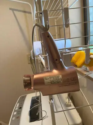a hair dryer on the side of a hospital bed at 匯家•平和島ビル in Tokyo