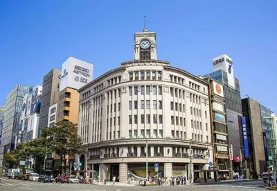 a large building with a clock tower on top of it at Green Sea Oshiage 5F in Tokyo