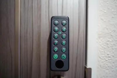 a remote control on the side of a door at Green Sea Oshiage 5F in Tokyo