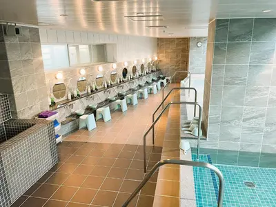 a bathroom with a row of sinks and toilets at Men Only Capsule Room & Sauna, Bathhouse, gim 男性専用サウナ&カプセル Minami Gakugeidai in Tokyo