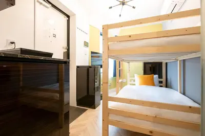 a room with a bunk bed and a mirror at LaVie\u521d\u53f0 in Tokyo