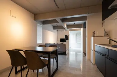 a kitchen and dining room with a table and chairs at Luxe\u5357\u9752\u5c71 in Tokyo