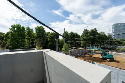 a building under construction in a city at Luxe\u5357\u9752\u5c71 in Tokyo