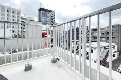 a view from the balcony of a building at \u30bf\u30b9\u30adsmart\u6771\u65b0\u5bbf in Tokyo