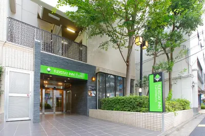 a building with a hospital ml sale sign in front of it at FLEXSTAY INN Ekoda in Tokyo