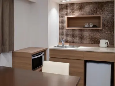 a kitchen with a sink and a counter top at HOTEL MYSTAYS Iidabashi in Tokyo