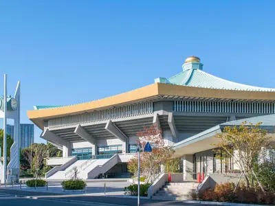 a building with a curved roof and stairs in front at HOTEL MYSTAYS Iidabashi in Tokyo