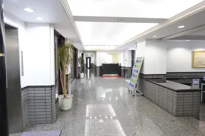 a hallway of a building with a lobby with at FLEXSTAY INN Shinurayasu in Urayasu