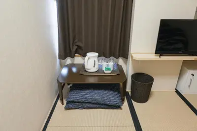 a small table with a tea kettle on it in a room at Lodging Tokyo Shibamata in Tokyo