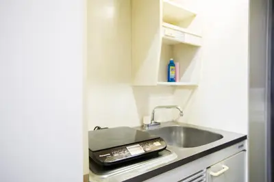a small kitchen with a sink and a sink at FLEXSTAY INN Shirogane in Tokyo